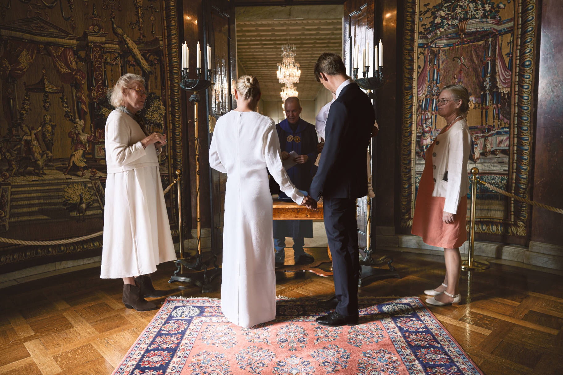 Family witnesses standing either side of the couple