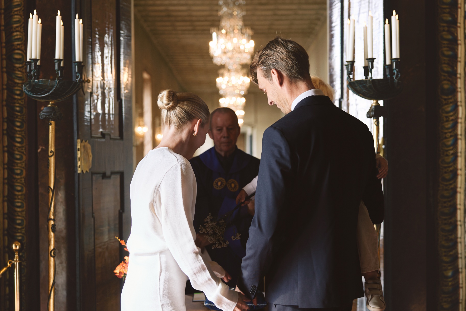 Heads bowed at the ceremony table