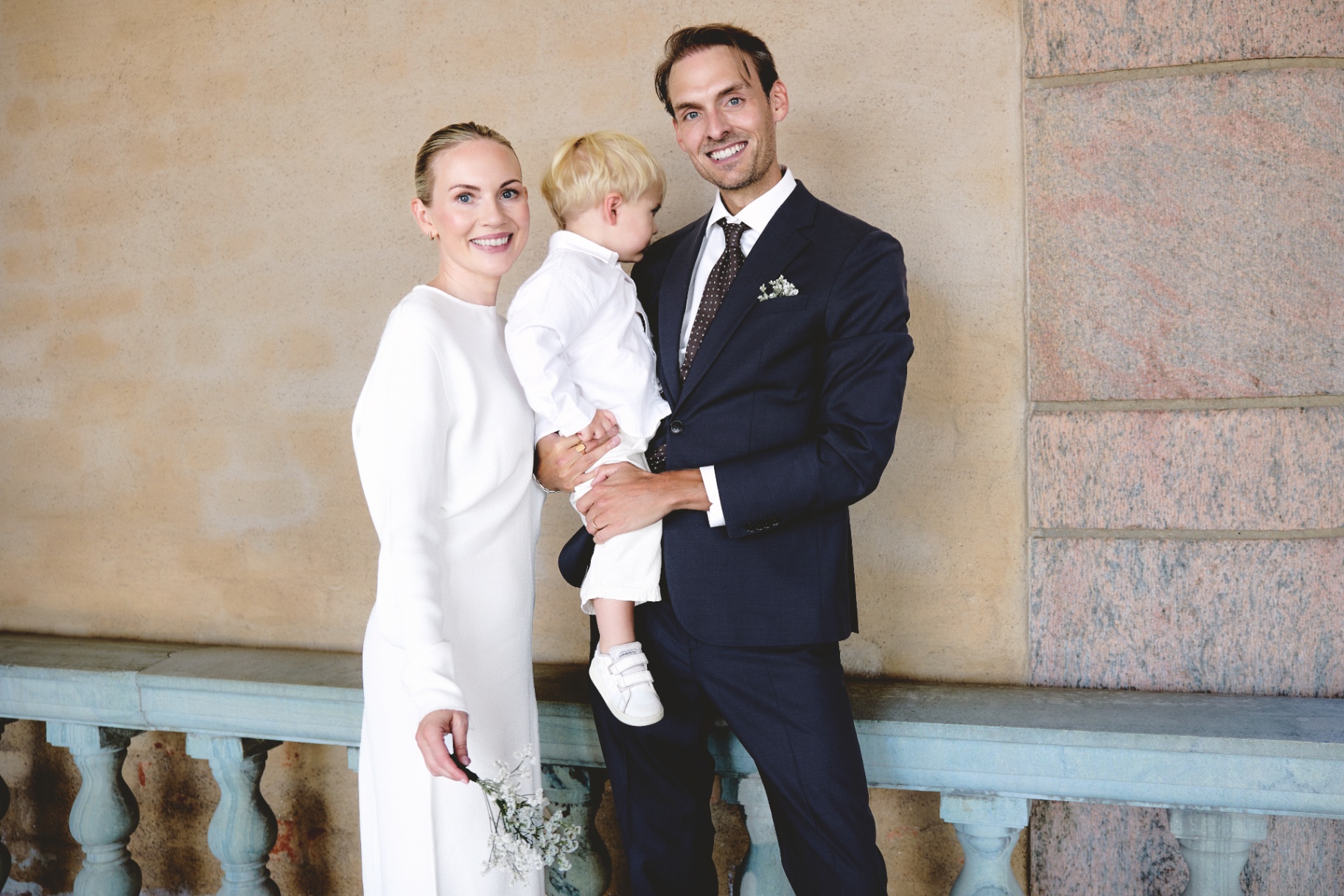 Family portrait against the ochre wall